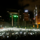 Pro-democracy protesters hold up their mobile phones during a campaign to kick off the Occupy Central civil disobedience event in front of the financial Central district in Hong Kong